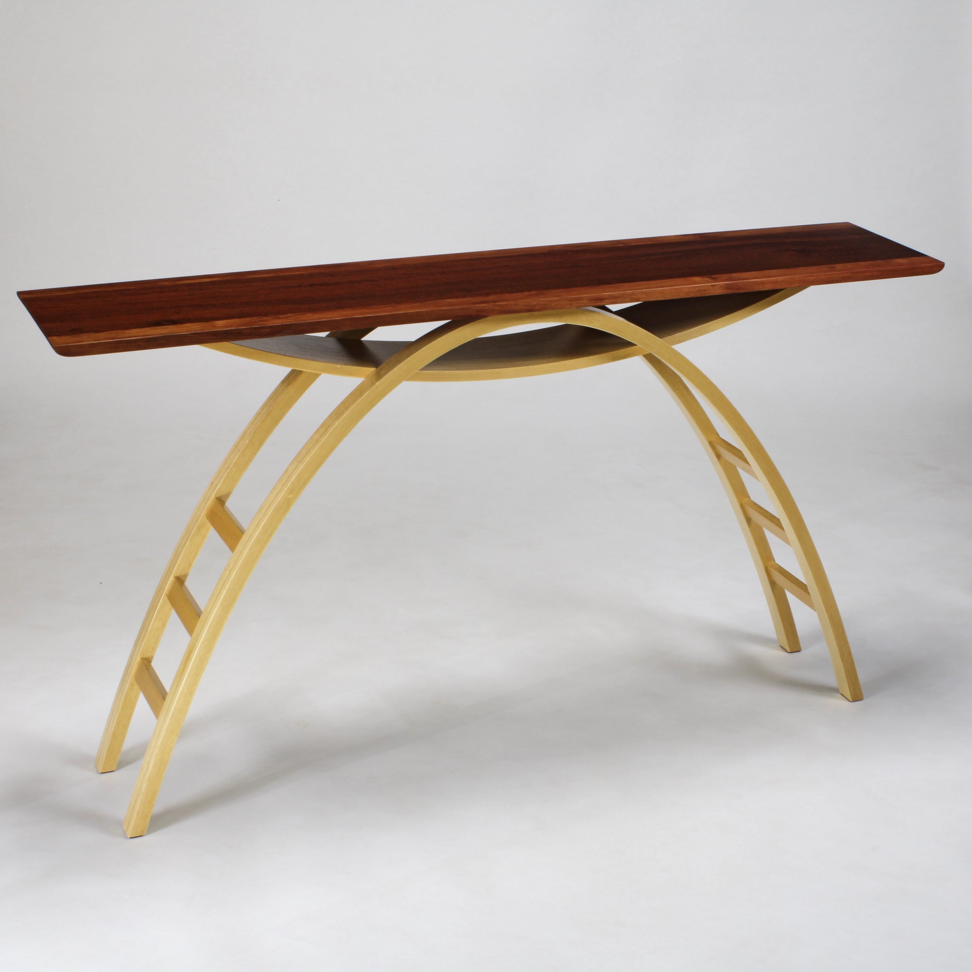 A hall table with arched leg structure